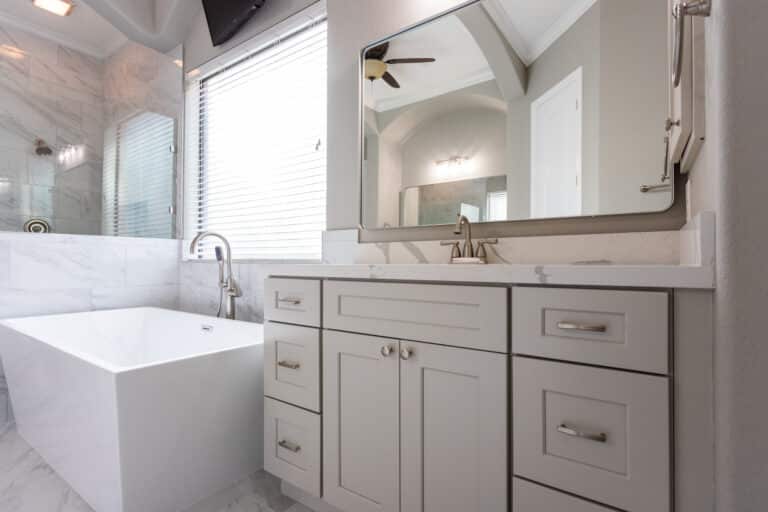 Make the bathroom function better with a better layout and more storage. Get rid of leaking toilets and faucets. Install a water-saving showerhead that functions better and makes showering more enjoyable. Add lighting above the vanities and other dark corners of the bathroom. Add a double vanity where there was only one sink. Add towel bars so everyone has adequate space for their towels.